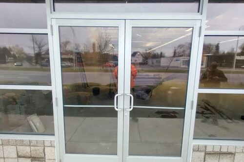 Photo of a commercial glass door done by Wolverine Glass.